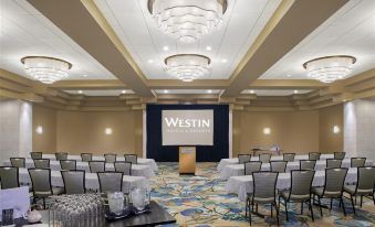 a conference room with chairs arranged in rows and a projection screen on the wall at The Westin St. John Resort Villas