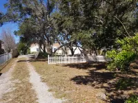 Close to beaches w/small private beach access across street, partial Gulf View. Hotels near Southwest Library