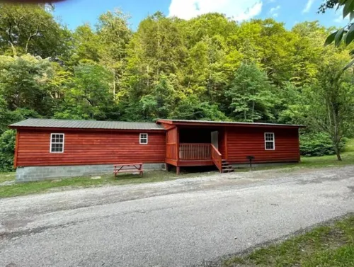 3BR, 2 Bath Cabin with full kitchen, living room, and hot tub.