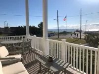 Beachfront - unbeatable location - steps to beach & shops - sunsets from porch!