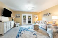 New Listing!  Ground Floor, Elegant 2 Bedroom Condo minutes from the beach.