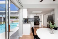 Sunny Escape: Vibrant Pool Home