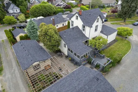 Family compound in North Tacoma!  Large house, guest house, game room, koi pond!