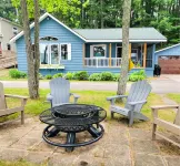 NEW! Renovated Bungalow steps from Lake Tomahawk - King Bed, Dock Space, Firepit