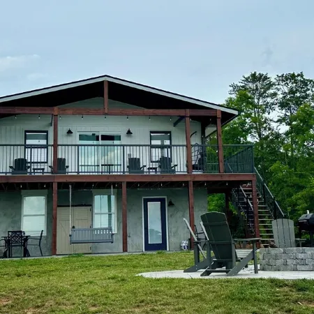 BRAND NEW Lake Front home. Private cove and boat dock! Modern farmhouse appeal!