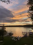 Relax in Raymond's lakefront 2-bedroom vacation home, just steps to Sebago Lake
