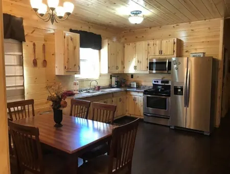 4BR 2 bath house with full kitchen, living room, hot tub and game room.