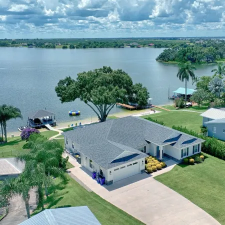 Newer Home on Lake June with Beach, Dock, Screened Patio and Hot Tub!