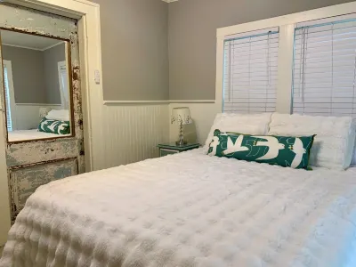 Cozy 2 BR Cottage with Inviting Sunroom, Spacious Yard and Ultimate Comfort Hotels near Kyle Crossing