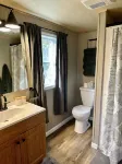 This tiny cabin is a peaceful place complete with stocked pond and kayaks!
