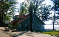 New Listing! Lake front cottage with 100' of private sandy beach