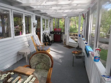 Screen Porch with see thru roof, BQ, 30' from sandy beach,  canoe and 3 kayaks