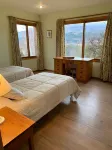 Beautiful log house on a hillside. Spectacular view. Sleeps 12