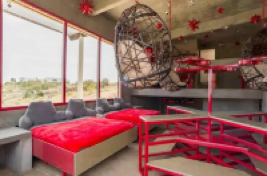 Eclectic Cliffside Den with Hanging Living Area