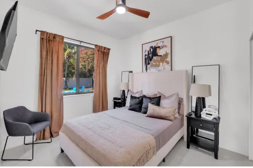 This Miami Vice Villa home is a stunning Saltwater Heated pool/Jacuzzi spa Oasis