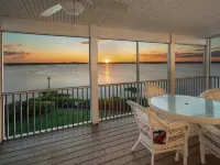 Large home on private penninsula with waterfront and views on three sides.