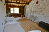 Stone house with garden, barbecue and fireplace.