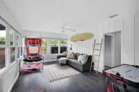 Mid-Century Boho Chic home with Pool, Game Room & Outdoor Playhouse.