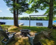 NEW! Renovated Bungalow steps from Lake Tomahawk - King Bed, Dock Space, Firepit