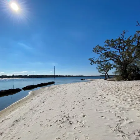 Renovated 1970’s retro camper on Bayou Grande in Pensacola with walking trail.