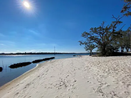 Renovated 1970’s retro camper on Bayou Grande in Pensacola with walking trail.