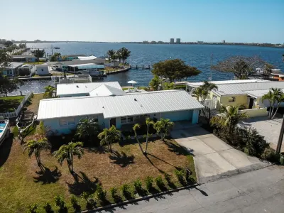 Stunning Waterfront Home! Sleeps 8 Heated Pool Hot Tub Boat Dock Chef Kitchen Hotels near Naughty Monk Brewery