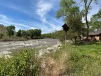 Remodeled Cabin on 40 private acres of Wind River frontage with R/V hookup.