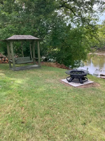 Gound level and private home with 142 feet of river front access.