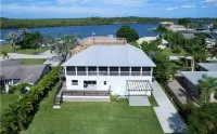 Raised home right on the Caloosahatchee River. Come enjoy the water and weather