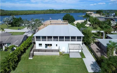 Raised home right on the Caloosahatchee River. Come enjoy the water and weather