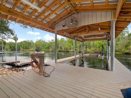 3-bedroom Riverfront home with private boat dock and view of Steinhatchee River.