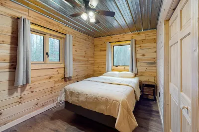 New dog-friendly cabin with river views, grill, modern interior, W/D, and AC