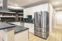 Spacious Open Kitchen and Exposed Brick - Stunning Urban Retreat