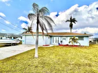 Sunny Canal-Front Home w/ Lanai & Grill! Hotels near Cycle Co Cape Coral
