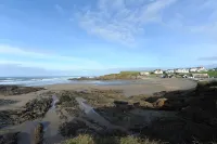 Pendragon House Overlooks Crooklets Beach in Bude with parking for 5 cars.