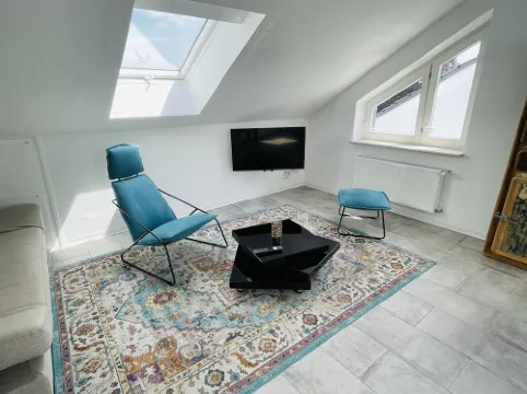 Bright, spacious attic apartment.