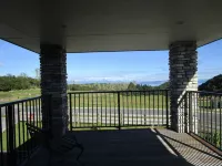 Apartment with lake, mountain & rural views.
