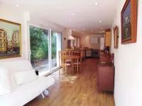 Large garden with swimming pool.