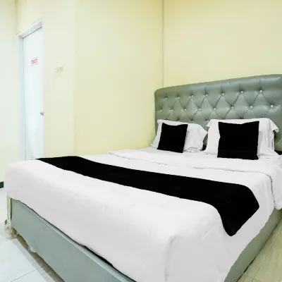 OYO 94806 Kostel 97 Hotel dekat Pelataran Benteng Kuto Besak