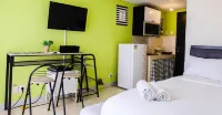 Cozy Studio Serpong Greenview Apartment by Travelio