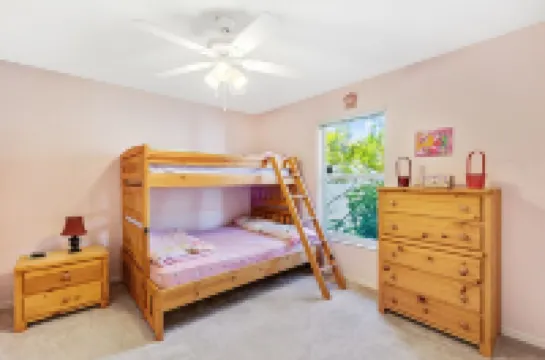 Fenced, private, family friendly villa with exotic poolside views near airport.