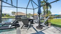 Gulf access pet friendly waterfront oasis with NEW heated salt water pool & spa