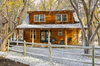 Cozy Log Cabin located on scenic acreage with trees and privacy.