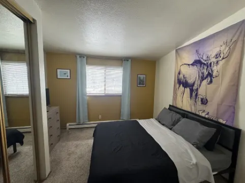 One Bedroom Top Floor Condo with Mountain View from Bedroom and Covered Parking