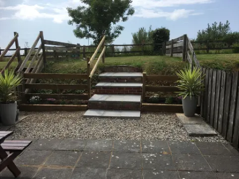 Barn conversion overlooking the golf course to the sea