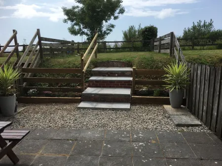 Barn conversion overlooking the golf course to the sea