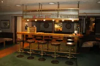Grichting Hotel & Serviced Apartments - bar