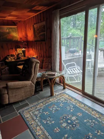 Direct lakefront cottage with wood burning fireplace in great room. Pet friendly