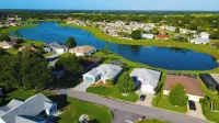 Premier home with Heated Pool, Waterfront, 2 king beds & 4 person golf cart.