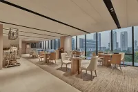 希爾頓古爾岡巴尼市中心 - 早餐